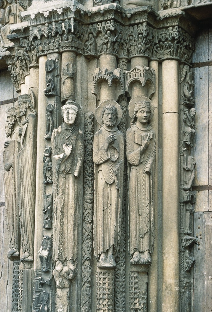 Figure 10-8: The jamb statues on the west portal (entrance doors) of the Cathedral of Chartres stand in a pose that is determined by the column, as if they were an extension of it.